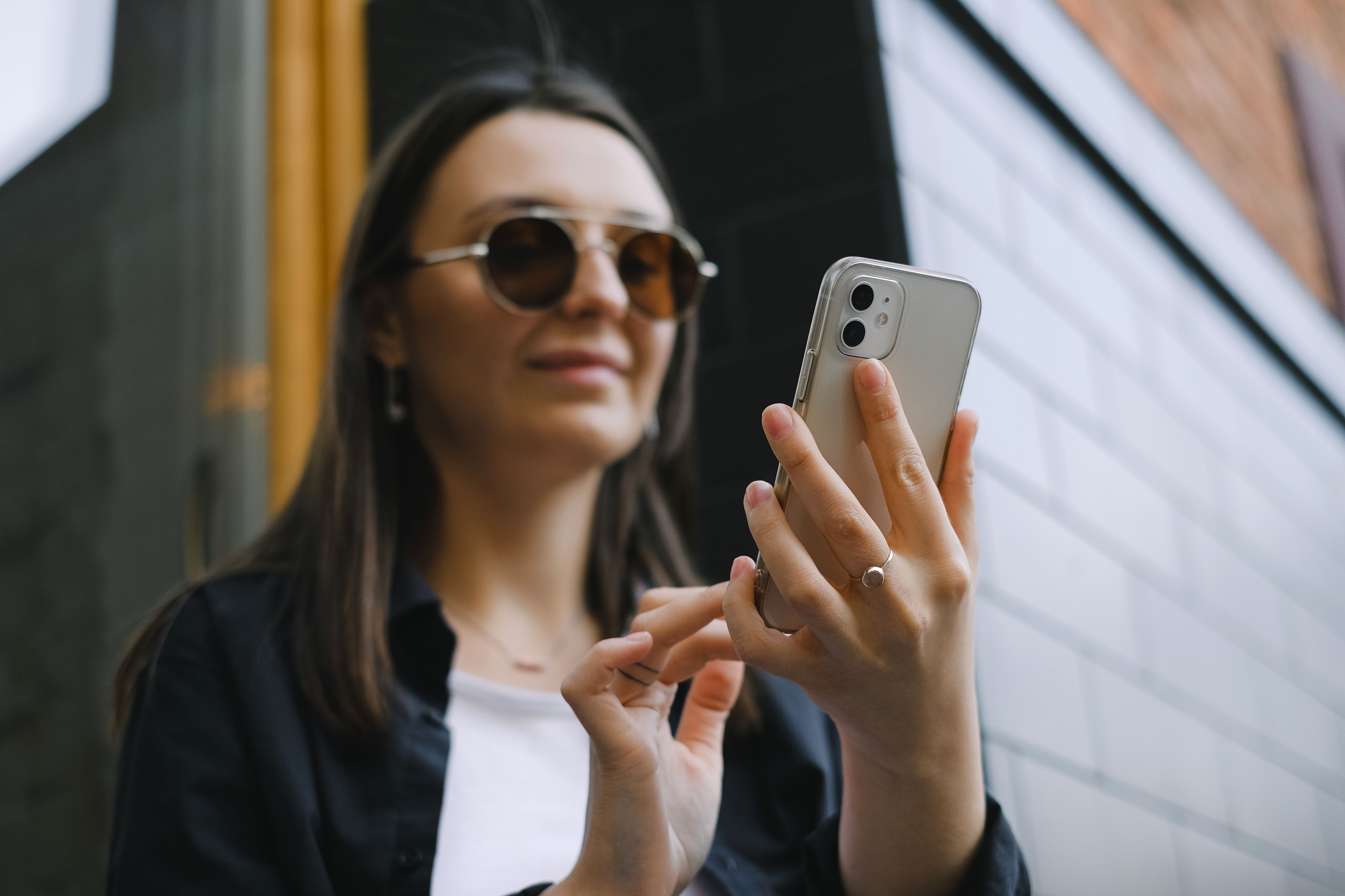 Hands holding a phone, face not shown, representing privacy